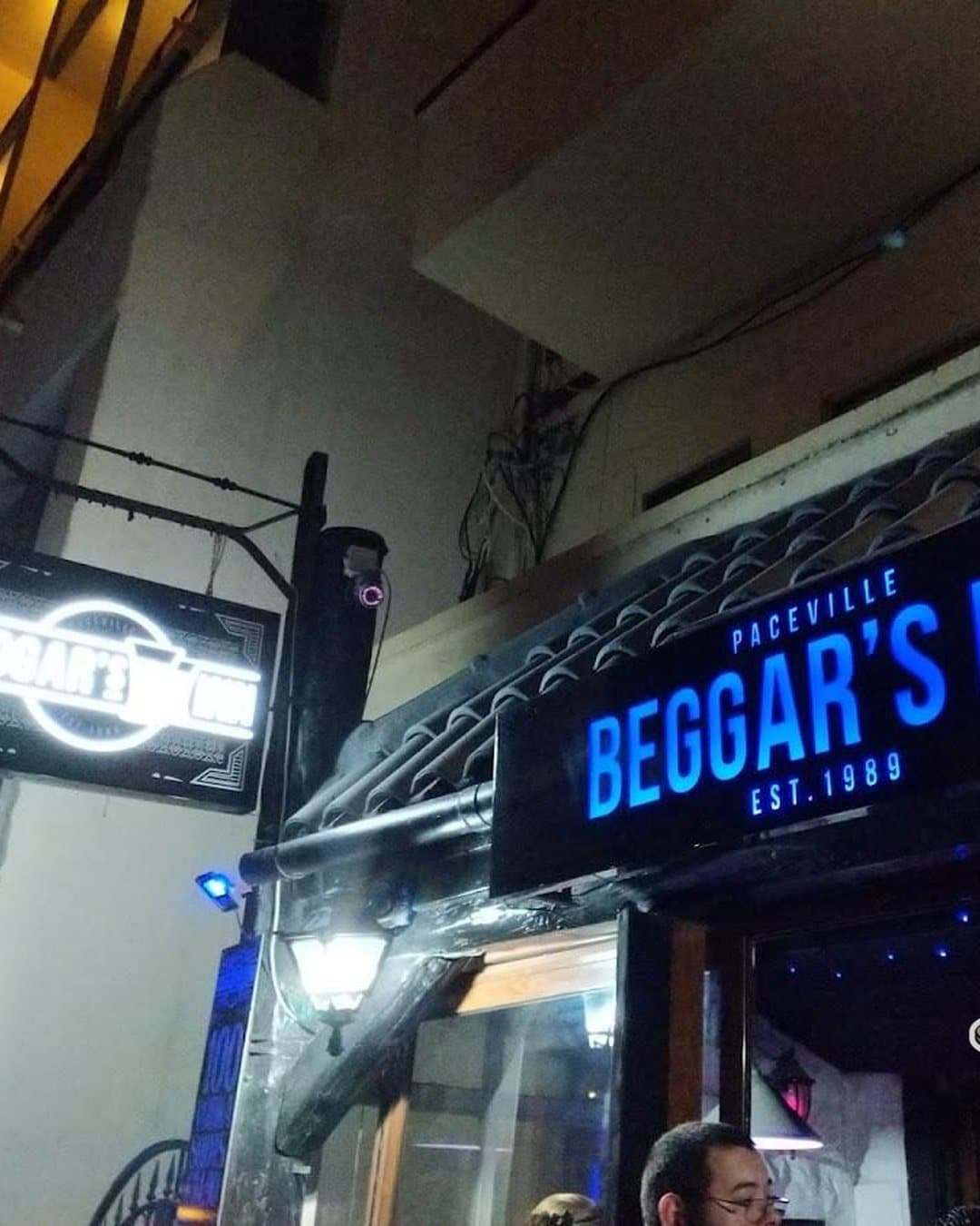 Beggar's Inn exterior signage at night in Paceville
